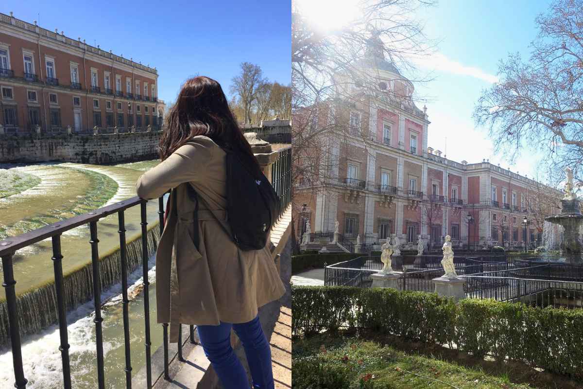 A woman in a khaki trench coat and black backpack leans against a railing, overlooking a cascading river with a historic building in the background. On the right, a grand palace with a dome and a sunlit courtyard filled with statues and greenery. Best day trips from Madrid.