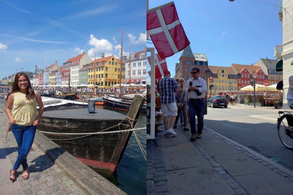 A solo female traveler stands smiling by the edge of a canal in Nyhavn, Copenhagen, with colorful, tightly packed buildings painted in shades of yellow, orange, blue, and red lining the waterfront behind her. The wooden hull of a historic boat with thick ropes is docked in the canal. The sky is bright blue with scattered wispy clouds, and people are walking along the lively harbor. In another image, Danish flags with red and white crosses hang above a cobblestone street filled with pedestrians, many of whom are holding ice cream cones and shopping. Copenhagen is one of the 13 Best of Solo Female Travel Europe Destinations, known for its welcoming atmosphere.